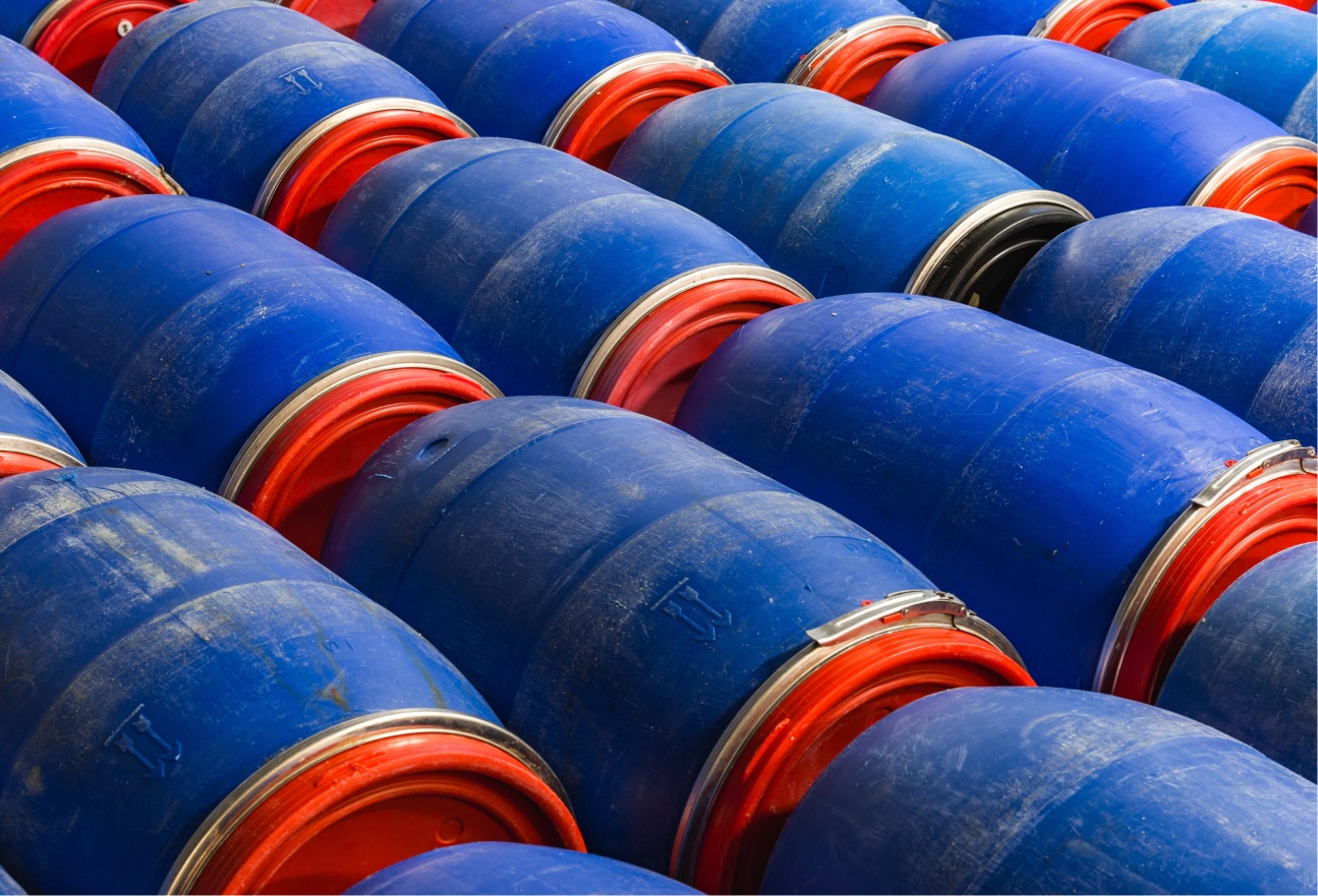closeup-shot-blue-barrels-factory-1